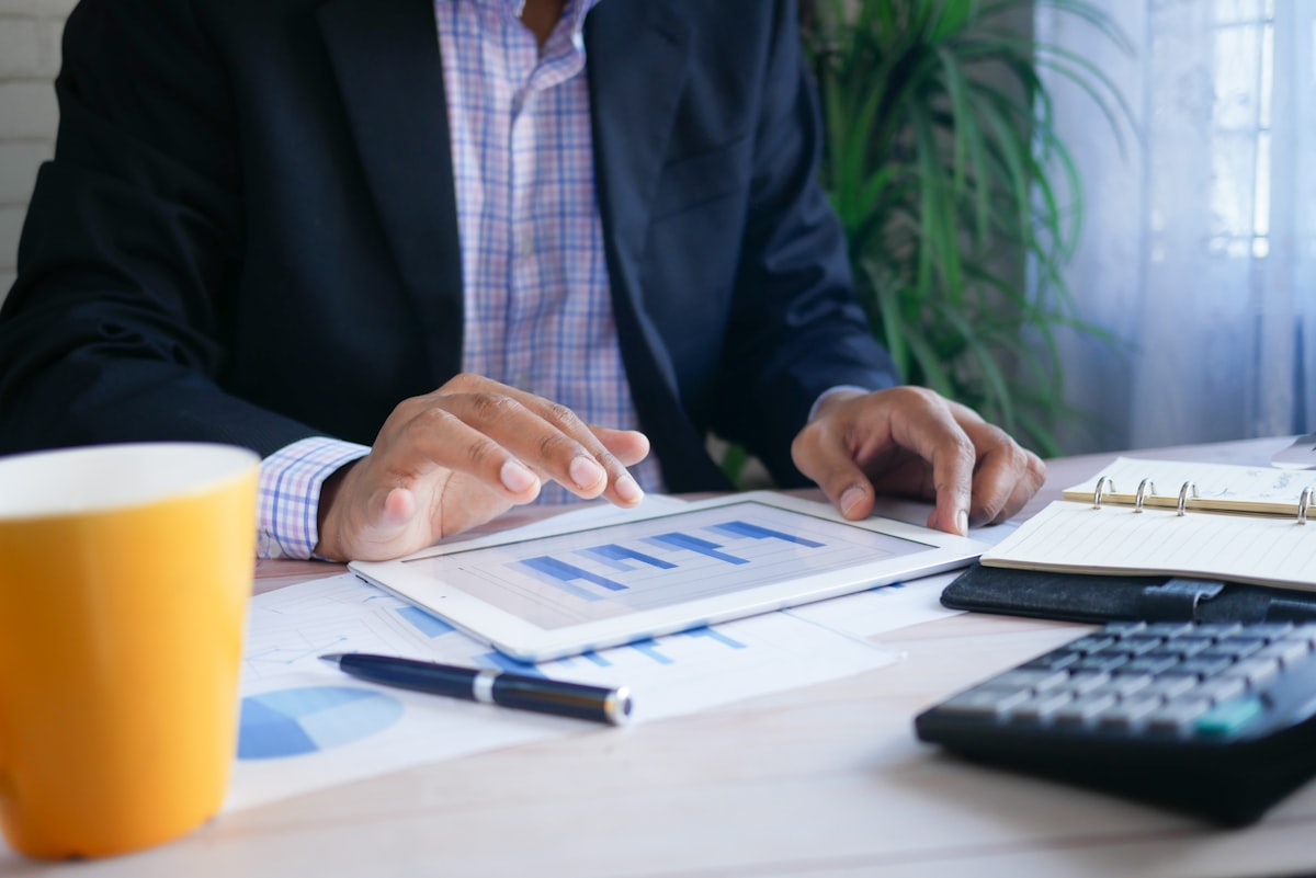 Advisor reviewing figures on a tablet
